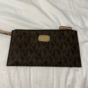 Michael Kors wristlet brown. New without tags